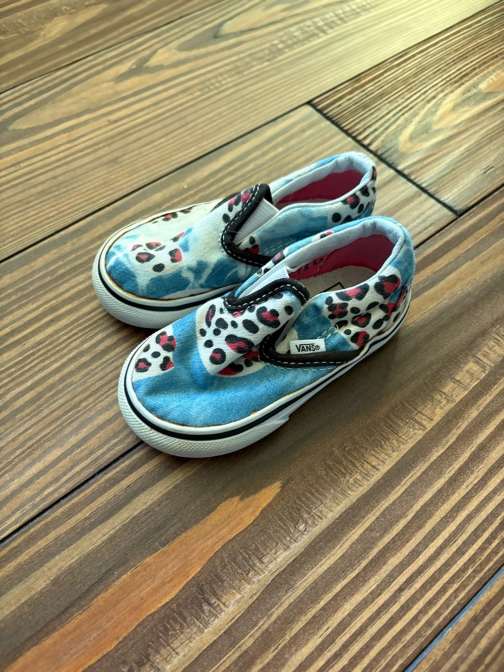 Vans Kids Slip-On Sneakers in Blue with Pink Leopard Accents